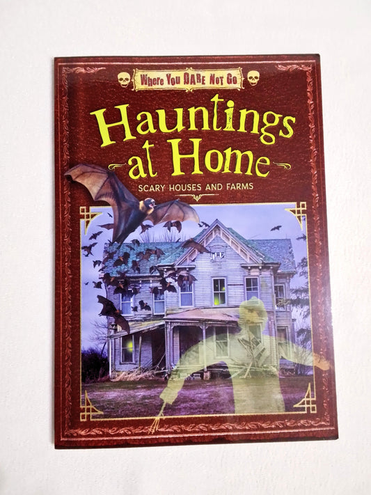 Book titled 'Hauntings at Home' with a cover featuring a house and ghostly figure on a white background.
