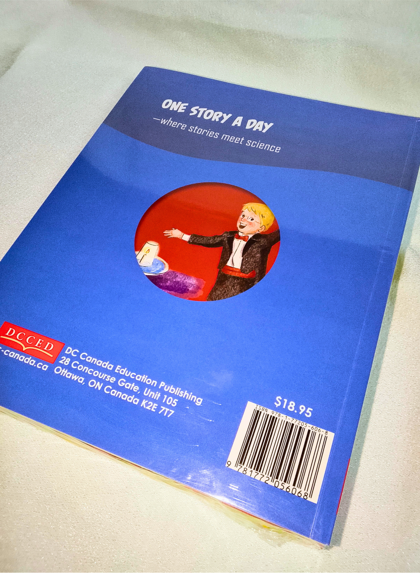 Blue book with a red circle featuring a person and text on a white background