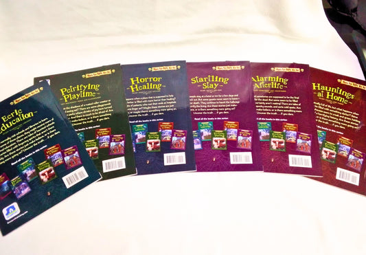 Collection of books with colorful covers on a white surface