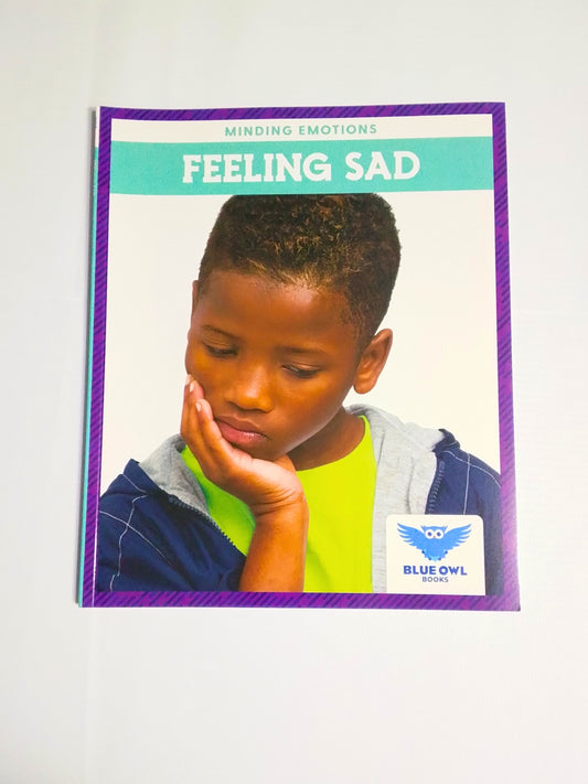 Card showing a child with 'Feeling Sad' on a white background