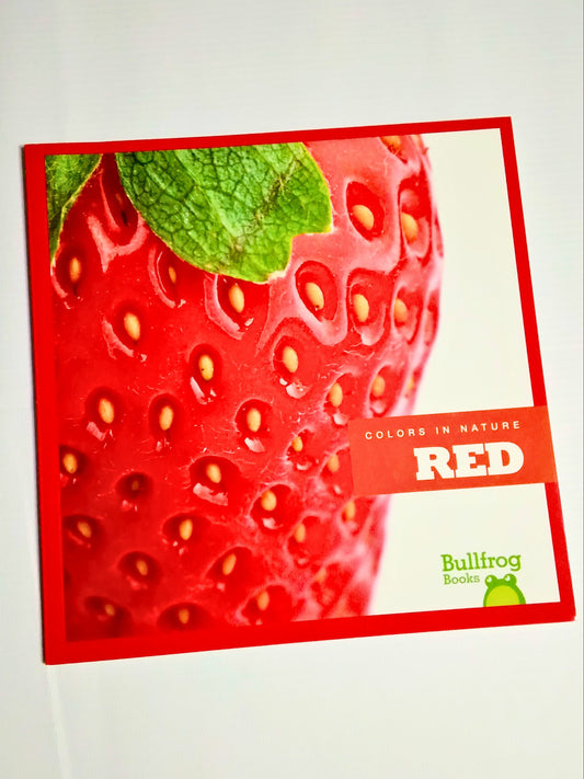 Red strawberry-shaped candy packaging with a green leaf on a white background