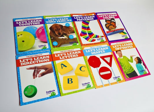 Set of educational children's books on a white surface