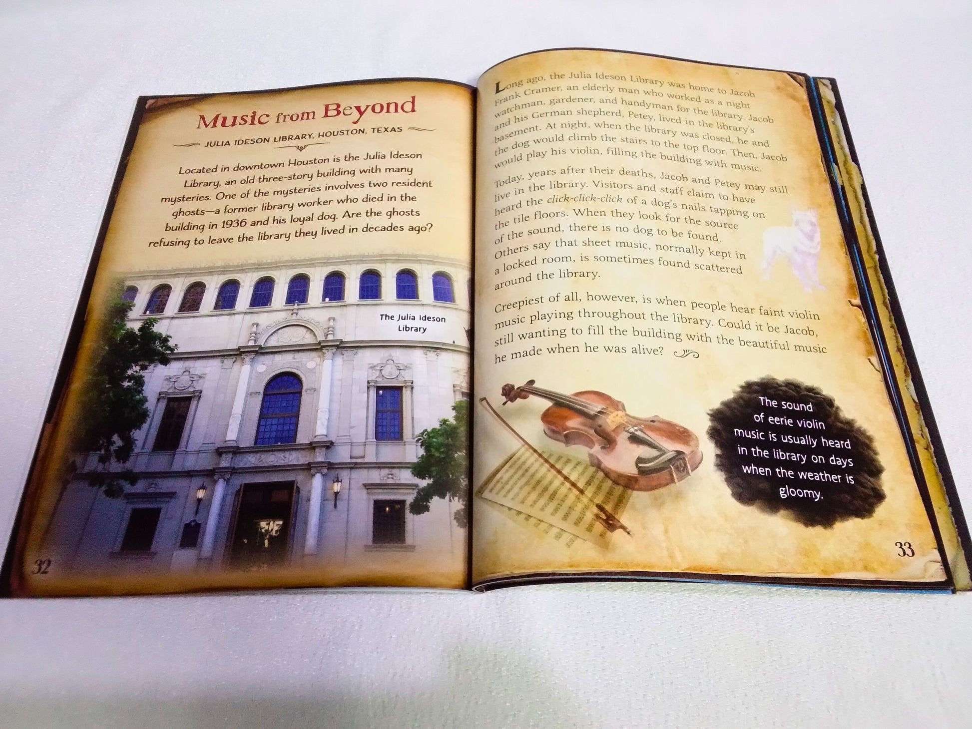 Open book with a violin illustration and text on a white background