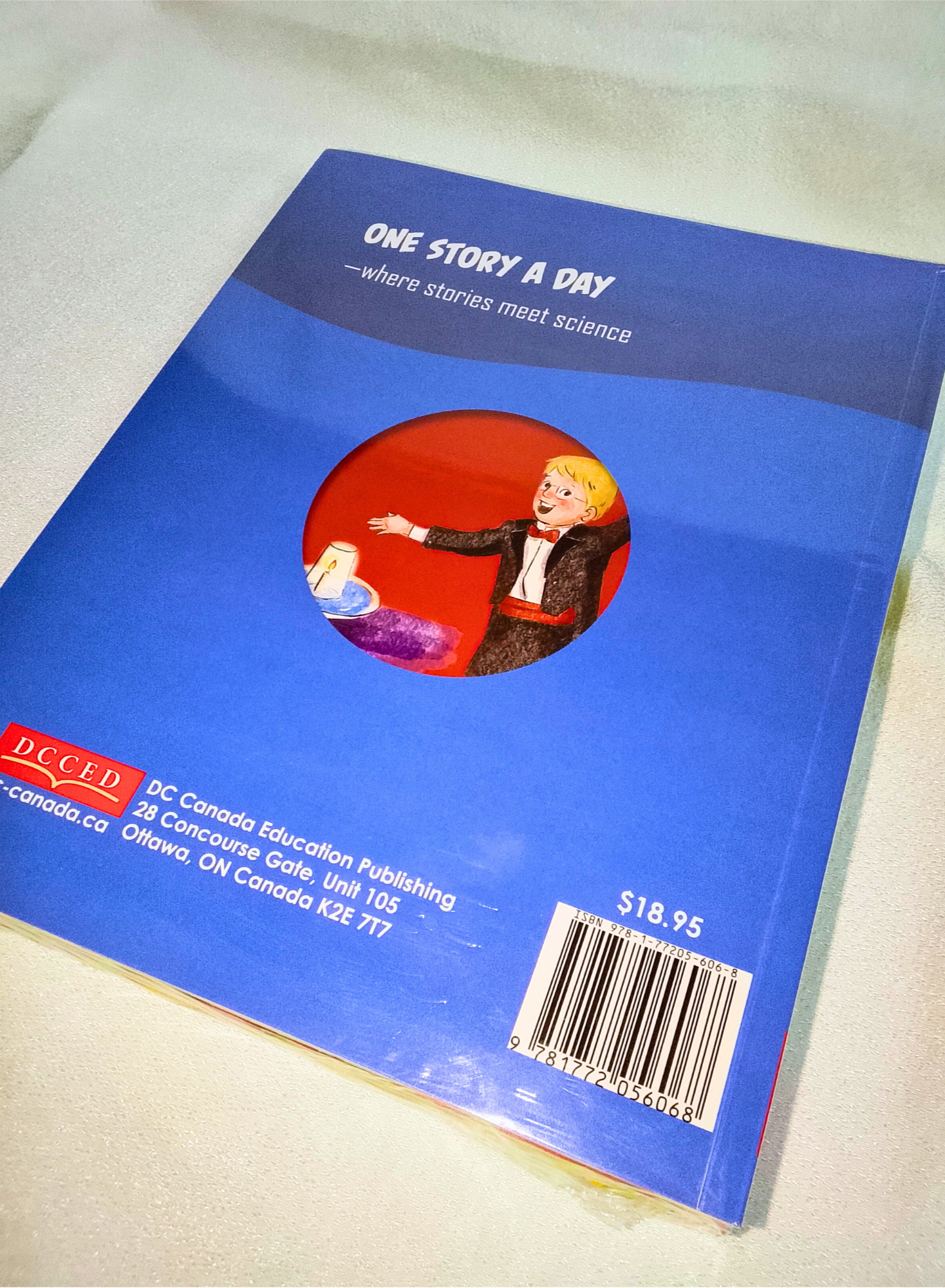 Blue book with a red circle featuring a person and text on a white background