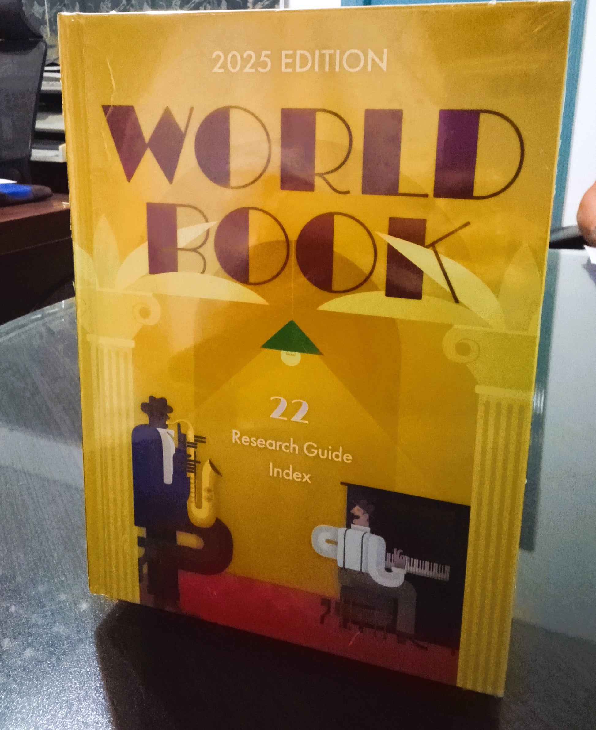 World Book 2025 Edition on a reflective surface