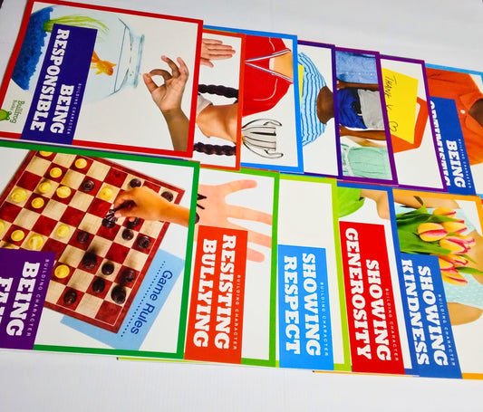 Educational posters on a table with various social skills topics.
