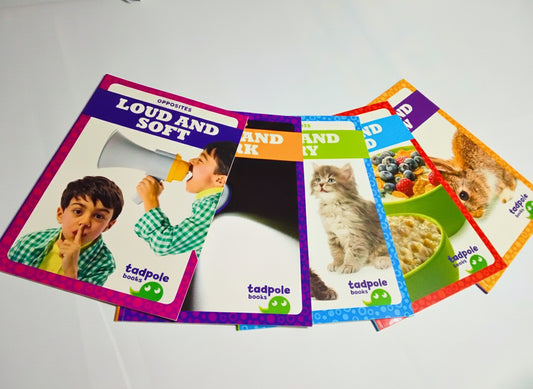 Set of colorful children's books on a white surface