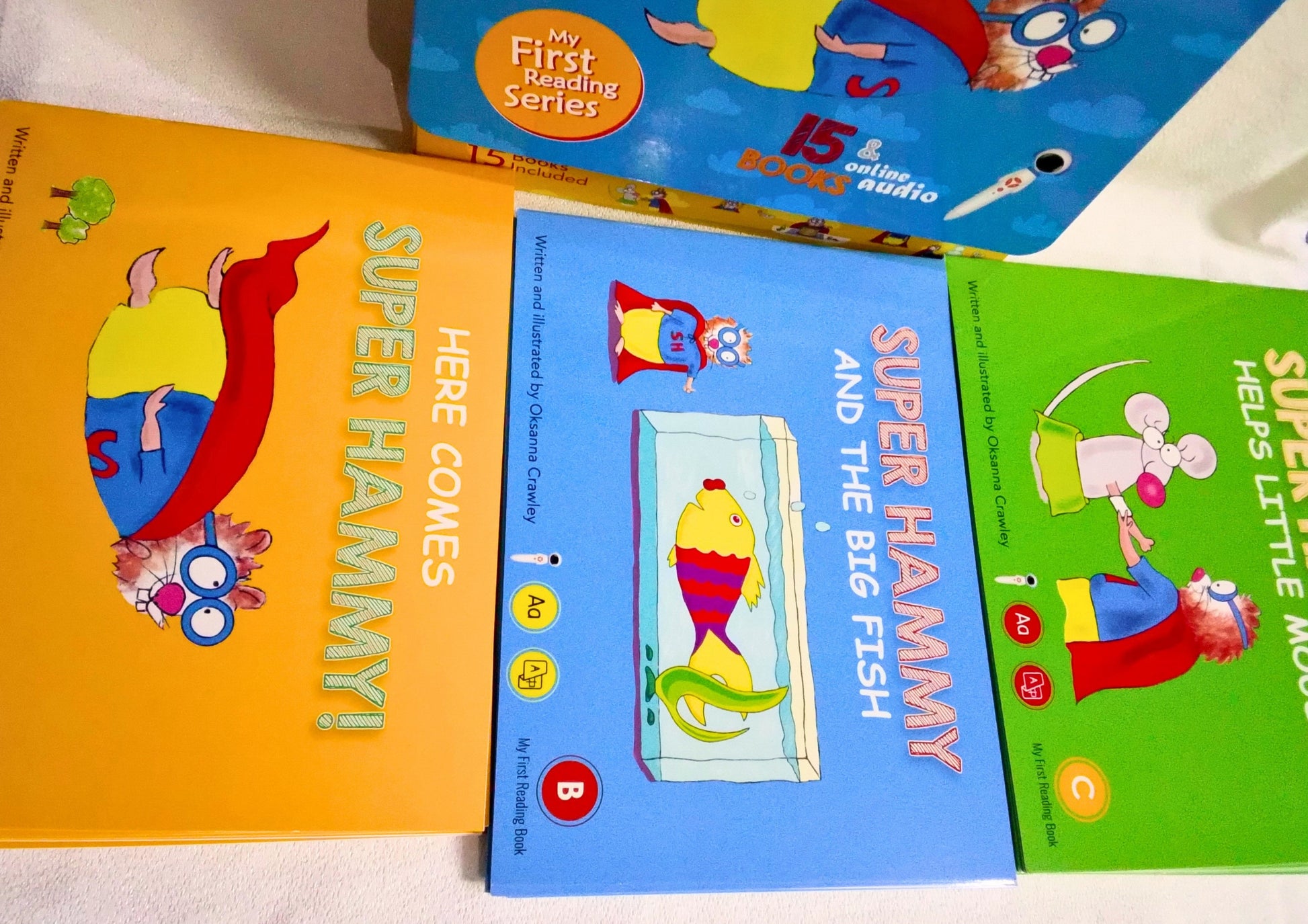 Children's books featuring Super Hammy on a white surface
